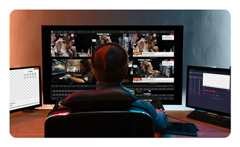 someone using the tricaster mini s on a pc at a desk