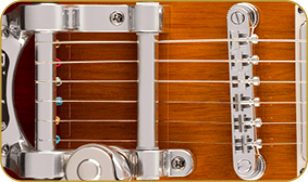 Squier Paranormal Troublemaker Telecaster® Deluxe Bigsby®, Laurel Fingerboard, Parchment Pickguard, Honey Sunburst