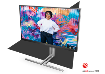 image of AOC U32U3CV Monitor on grey triangle with colourful desktop background image and Red Dot award winner logo