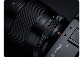 close up photograph of Fujifilm XF18mm F1.4 R LM WR manual focus control ring
