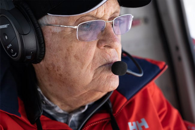 XF50mm R WR sample image from nora nussbaumer of old man flying in helicopter wearing bose headset with microphone