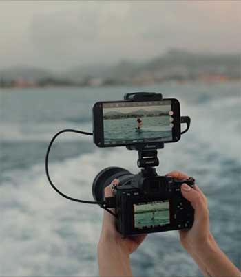 person recording video with Accsoon SeeMo 4K mounted on top