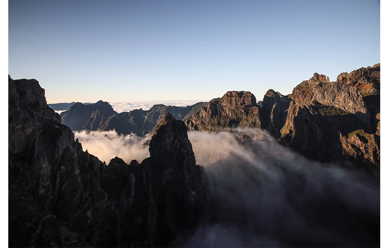 sample image of mist rolling between some mountains taken on the canon r5 c