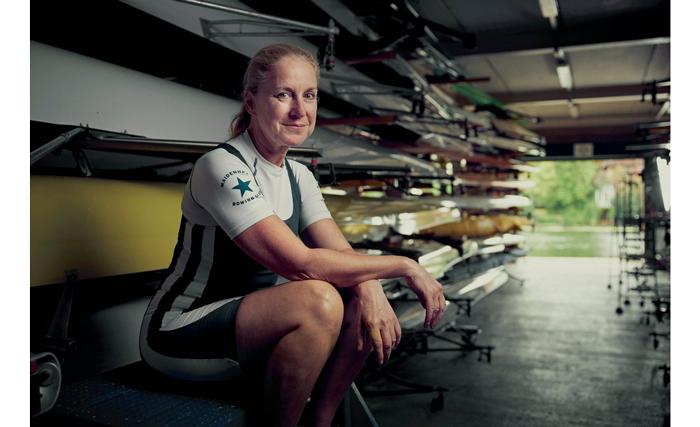 Csample image of a woman sat next to rowing boats taken with the canon rf 24