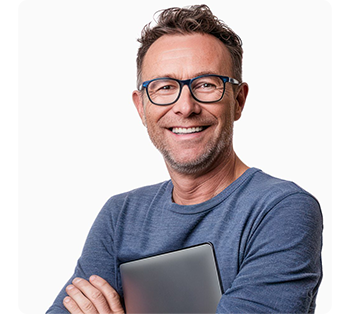 Middle aged male graphic designer holding macbook in crossed arms
