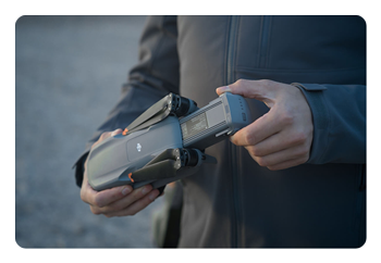 someone holding the dji air 3s
