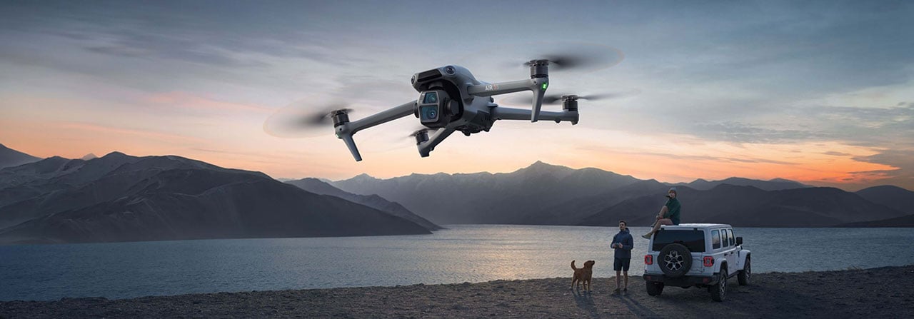 someone flying the dji air 3s near a shoreline