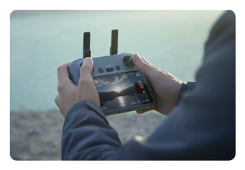 close up of someone controlling the dji air 3s using a controller