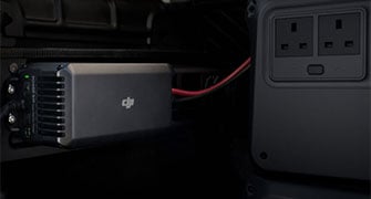 dji power 1000 v2 portable power station connected to a car