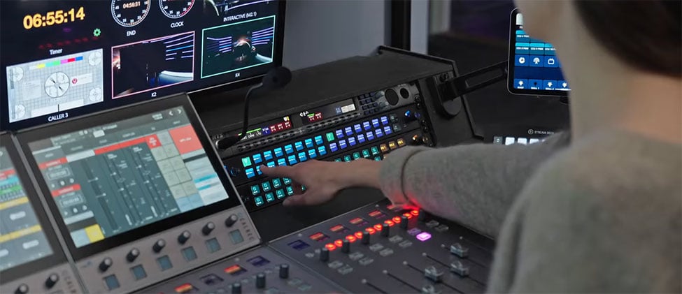 somoene using the elgato stream deck studio in a braodcast studio