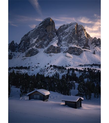 Hasselblad XCD 4/45P Lens sample image of mountainscape with wooden cabins covered in deep snow