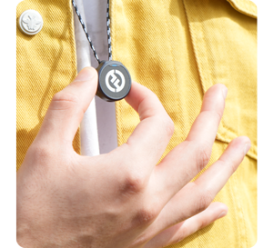 image of person holding Lark M2 on necklace 