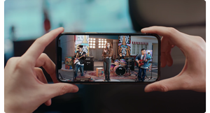 person holding smartphone with video live stream