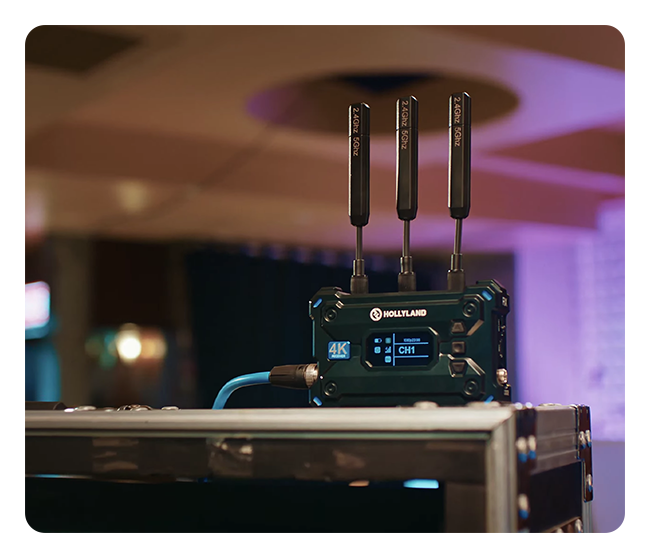 hollyland wireless reciever on top of a box on set