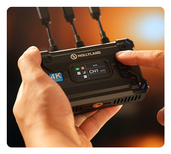 close up of someone using the hdmi transmitter and receiver showing the lcd sscreen