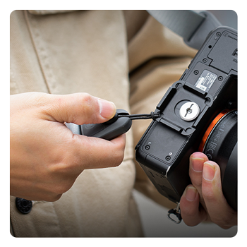 close up of the camera strap quick release plate