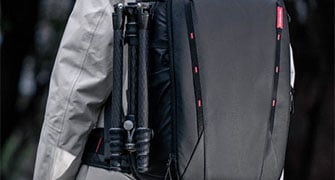 tripod attached to the side of the pgytech onemo 2 camera backpack