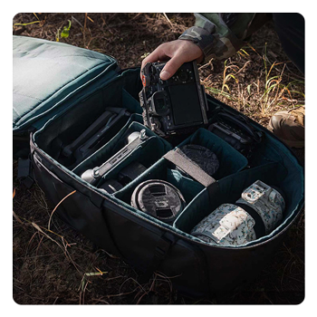 someone taking a camera out of the pgytech onemo 2 camera backpack