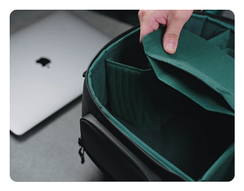 someone customizing the layout of the pgytech onemo 2 camera backpack