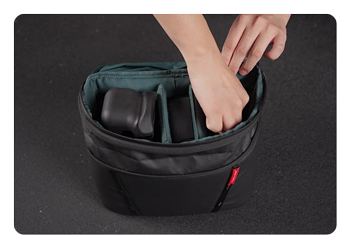 someone customizing the pgytech onemo 2 shoulder bag