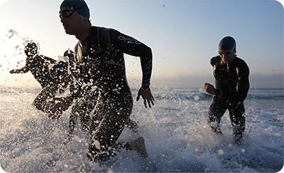 sample image of swimmers running out water taken with the sony a9 iii