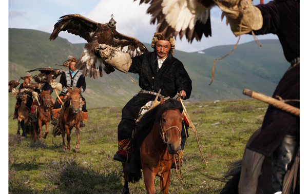 Sony E 16-55mm F2.8 G Lens Sample Image of mongolian eagle hunters riding on horse back carrying their eagles on arms