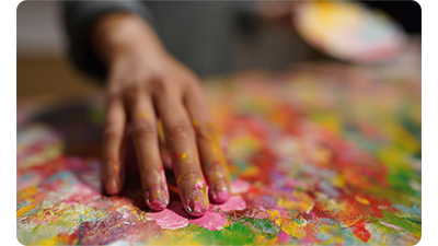 Sony FE 24mm F1.4 GM Lens sample image of artist painted canvas' covered with vibrant colour paints