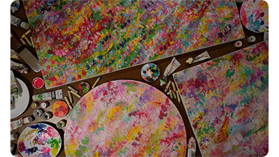 Sony FE 24mm F1.4 GM Lens sample image of artist painted canvas' covered with vibrant colour paints