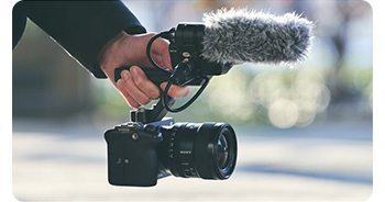 videographer using sony FX3 with XLR handle to capture video on location