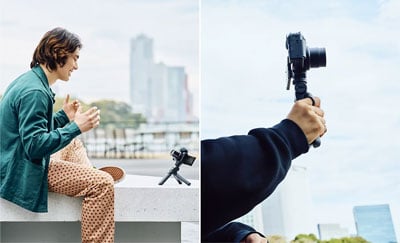 someone using the sony zv 1 ii compact camera with the grip