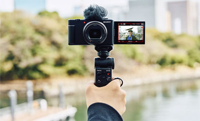 someone using the sony zv 1 ii compact camera