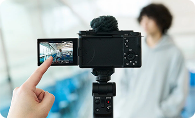 someone using the sony zv e1 vlog camera touch controls