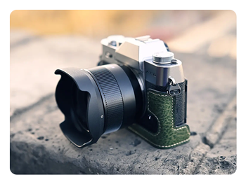 TTArtisan 35mm lens with lens hood attached to a camera