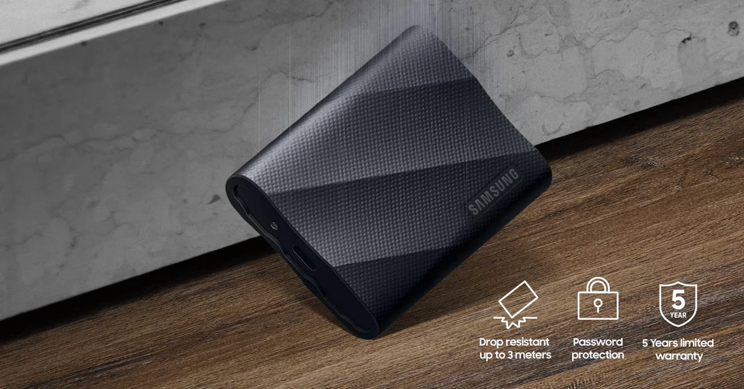 Samsung T9 SSD resting on a marble and wood surface